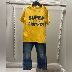 Levi's Blue Denim Jeans with Tan Leather Patch and Super Brother T-Shirt; size 5